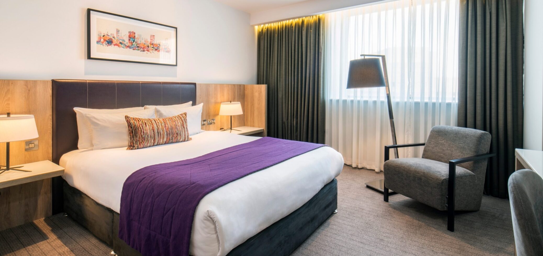 Hotel room in Birmingham with purple bedspread