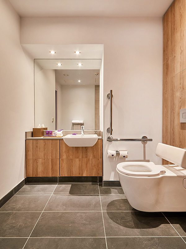 Park Regis Birmingham Accessible Bathroom in the deluxe room type, with a toilet, shower and sink