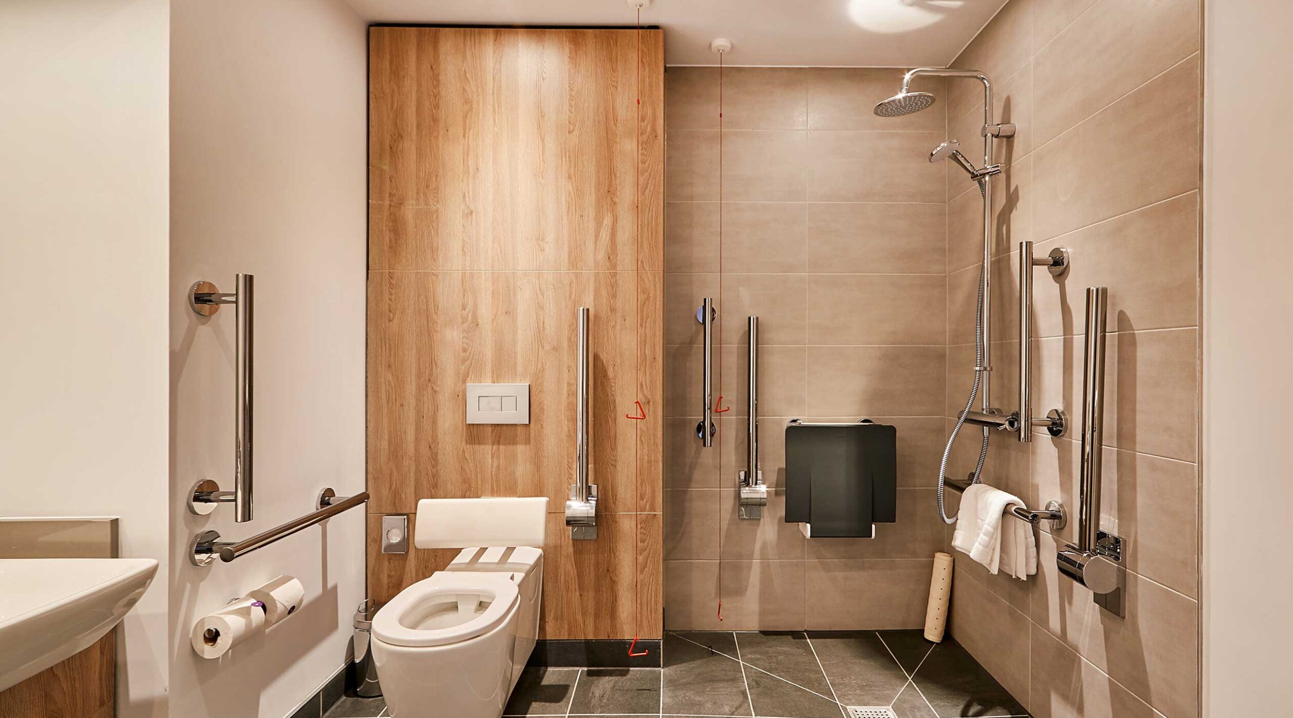 Park Regis Birmingham Accessible Bathroom in the deluxe room type, with a toilet, shower and sink