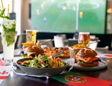 Burger, Salads, and Cocktails on the Table