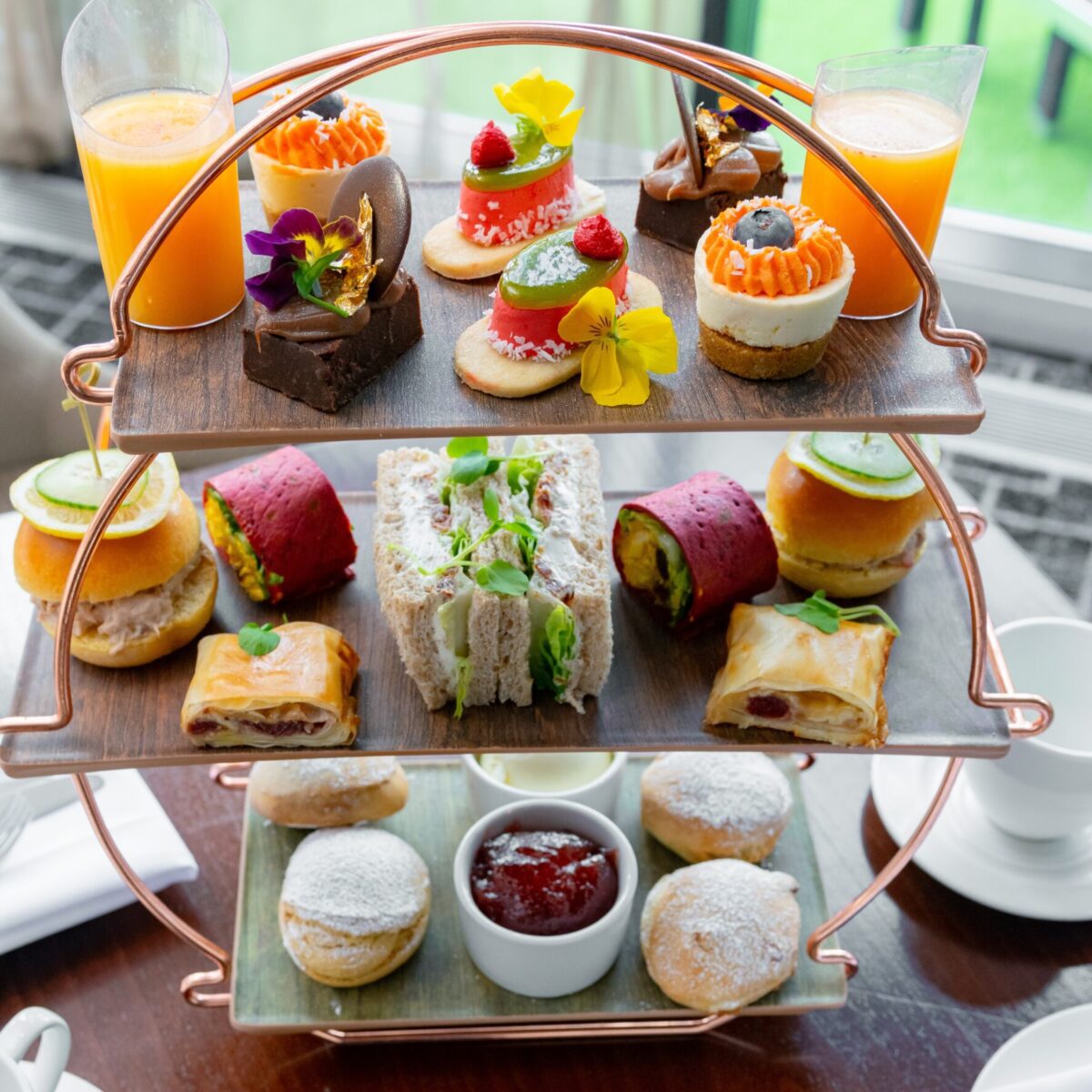 Three tiers of afternoon tea sweet and savoury items