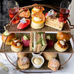luxury afternoon tea at Park Regis Birmingham, featuring finger sandwiches, mini cheesecakes, scones and more sweet and savoury delicacies.